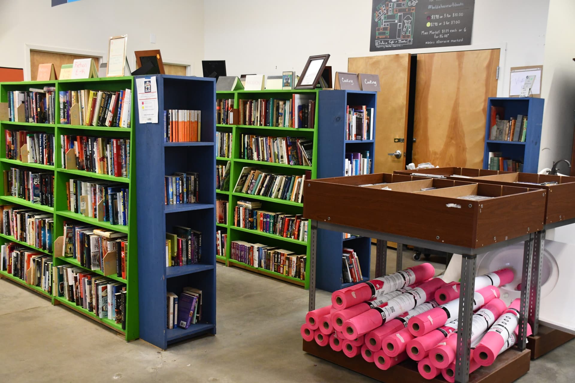 Library bookshelf with green book covers